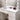 White vanity tabletop with lighted Hollywood mirror bulbs and cosmetics organizer