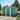 Green metal garden storage shed with apex roof, double front doors, and roof vents