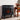 Freestanding electric fireplace heater on legs with orange flame glow through glass doors