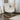 Cream sherpa armchair with high back, armrests, and wooden rocker runners