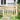Wooden pedestrian gate with X-pattern upper panel, vertical slats, black hinges