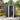 Lockable black metal storage shed with front door and vertical wall panels