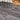 Gray wood-grain vinyl plank flooring with self-adhesive backing, waterproof