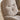 Light brown upholstered lounge chair arm and seat cushion detail