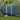Metal garden storage shed with hinged? door panel, ribbed walls and apex roof vents, dark