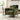 Green upholstered armchair with squared seat, armrests, and lumbar cushion