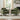 Pair of green upholstered armchairs with armrests and lumbar cushion