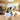 Electric paint sprayer HVLP with 1200ml cup and 4 nozzles, white and yellow handheld unit