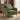 Green upholstered armchair with chenille texture, armrests, and tapered legs