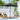 Freestanding patio umbrella with dark canopy and central pole