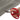 Gray wood-grain PVC flooring vinyl roll sheet being cut with red scissors