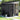 Metal garden storage shed with open side door and roof vent