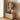 Freestanding wooden garment rack with wheeled storage basket and perforated doors