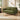 Green corduroy loveseat sofa with rolled arms, two back cushions, and dark wood legs