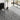 Marble-effect vinyl floor tile in dark gray with white veining, waterproof style