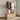 Wooden clothing rack with hanging rail, folded shelves, and wheeled woven storage drawers