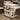 White overbed desk with tabletop and two side shelves, mounted on 4 caster wheels.