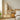 Wooden freestanding garment rack with hanging rail and woven storage bins on wheels
