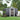Anthracite metal garden storage shed with open sliding door, apex roof