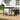 Retractable pergola with dark canopy stretched above outdoor seating