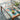 Hexagon peel-and-stick vinyl flooring roll with blue teal pink pattern on floor