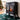 Freestanding electric fireplace heater angled view with orange flame glow behind glass