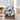 Black frame velvet armchair with white-and-black cowhide patterned seat and back