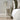 White wooden side table with drawer and open shelf, visible side panel