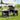 Foldable camping kitchen stand with wind shield, black grill with two side storage cabinets
