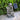 Solar fountain with three visible basins and flowing water over textured stone surfaces