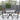 Set of 2 outdoor dining chairs with cushions, black metal chairs and light grey seat pads