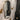 Oval gold metal wall mirror with thin rim for bathroom vanity