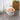 White pet food storage bin with orange flip-top lid, closed