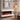 White wall-mounted electric fireplace with realistic flame effect and adjustable thermostat look.