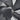 Wall-mounted axial exhaust fan with black grille and protective fan blades