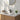 Black basin mixer tap with tall spout and single lever on white countertop