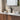 Black bathroom basin mixer tap with tall curved spout and single lever, deck-mounted.