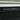 Close-up of black electric firebox vent grille under the white mantel