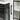 White cabinet door with curved black handle beside electric fireplace controls