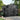 Anthracite metal apex roof storage shed with double doors and side windows