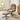 Light brown chenille lounge chair with matching footstool and black swivel base