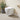 Wall-mounted elongated white toilet with wall-mounted flush