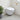 Wall-mounted elongated white toilet with closed seat