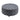 Grey round tufted ottoman with linen upholstery and studded edge detail