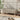 Beige linen upholstered bench with wooden legs, low rectangular silhouette.