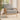 Grey linen armchair with woven rattan side panels and cushioned seat