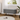Gray upholstered accent bench with rounded arms and tapered metal legs