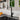 Black pull-out kitchen faucet with chrome sprayer over kitchen sink