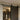 Black barn door hardware rail with circular roller brackets on a wooden door