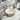 Gold ceramic round vessel sink with white basin and chrome square faucet